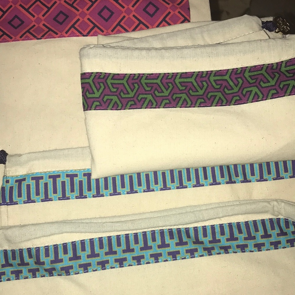 6-pc 4-Tory Burch, 2-Prada shoe bags.